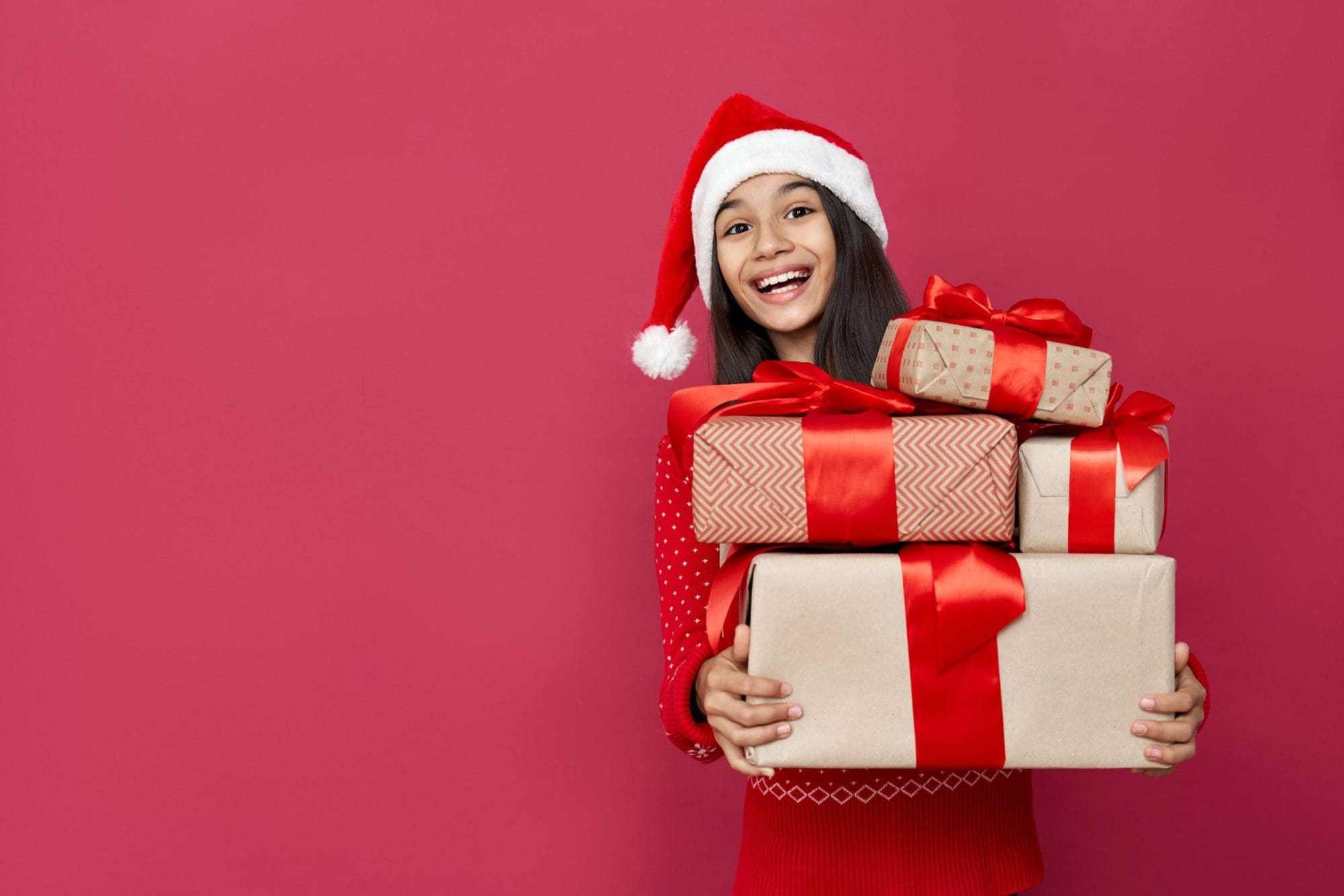 Holiday Child Holding Present With Red Background